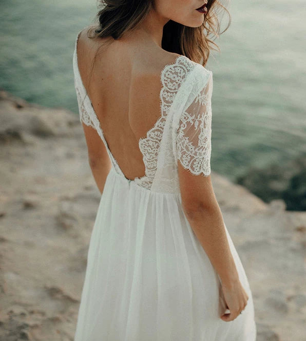 Young woman wearing the beach dress by Luna Bride.