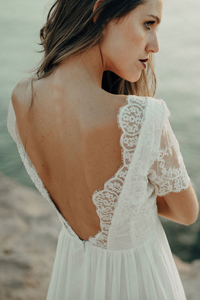 Young woman wearing the beach dress by Luna Bride.